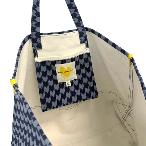 The KR heart blue check tote made from 100% cotton canvas with an inside pocket and an imperfect heart bag charm - Shop women’s tote bags by Kerri Rosenthal
