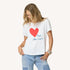Suke white tee featuring Kerri's Imperfect Heart and 'Fool for Love' artwork in 100% cotton.