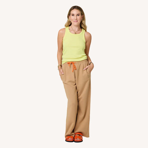 Weekend Barb camel sweatpants in 100% cotton fleece with a yellow tank top by Kerri Rosenthal