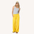 Weekend yellow palazzo sweatpant in 100% cotton fleece with grey tank top and elastic waist by Kerri Rosenthal