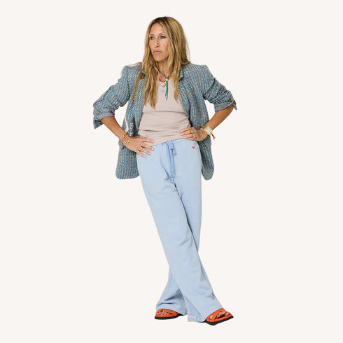 Workday Love Rises multicolor single-breasted blazer jacket in wool blend with heart elbow patches and light blue sweatpants.