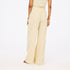 Beige wide leg cotton palazzo pants in 100% cotton blend with heart embroidery and an elastic waist by Kerri Rosenthal