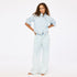 Light blue wide leg palazzo pants in 100% cotton denim with light denim jacket by Kerri Rosenthal