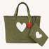 Olive green canvas tote bag with a white heart print and a red heart-shaped keychain charm with a matching pouch/wristlet