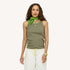 Model wearing an olive green ribbed tank with a small pink heart embroidery, a green heart-print bandana tied at the neck, and cream cargo pants by Kerri Rosenthal