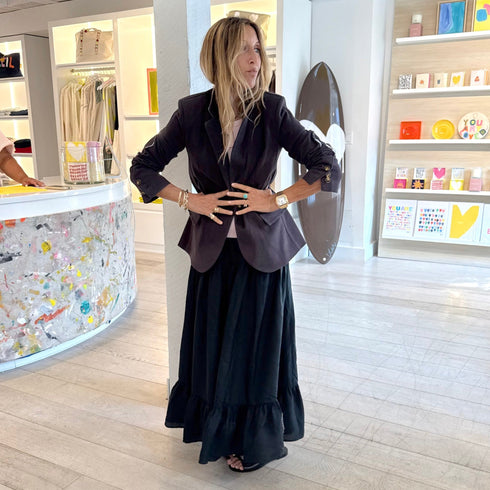 Kerri Rosenthal coal tailored blazer styled over black tiered maxi skirt, boutique lifestyle shot. Shop Kerri Rosenthal blazers