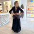 Kerri Rosenthal coal tailored blazer styled over black tiered maxi skirt, boutique lifestyle shot. Shop Kerri Rosenthal blazers