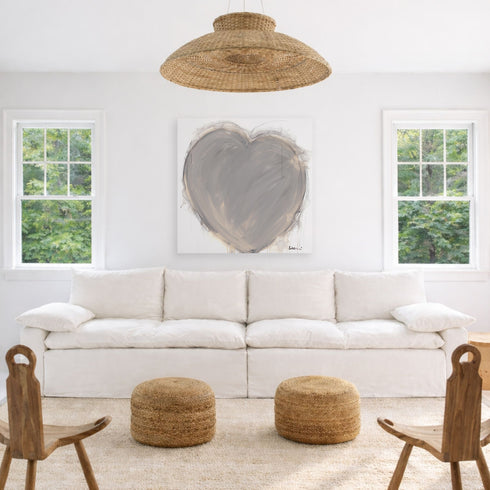Crazy, Messy, Beautiful Life art print: a large taupe-gray heart with loose, painterly brushstrokes and a charcoal outline with drips running down, on a white canvas, hung in a room setting