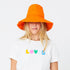 Stylish orange sunny daze cotton bucket hat big brim and embroidered details - Cute designer bucket caps hats by Kerri Rosenthal