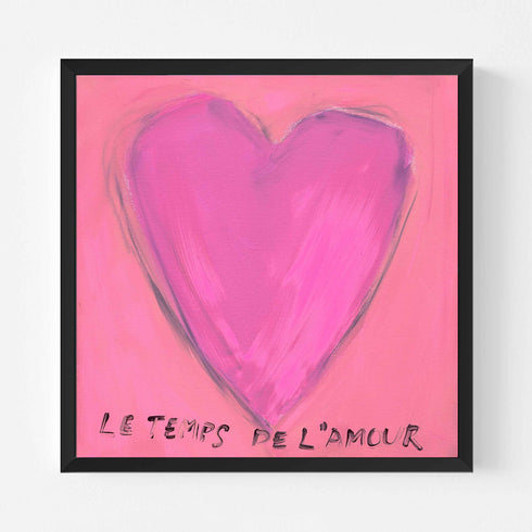 Le Temps de l'Amour art print: a magenta-pink heart on a pink background, with "Le Temps de l'Amour" hand-painted below it in black, in a black frame