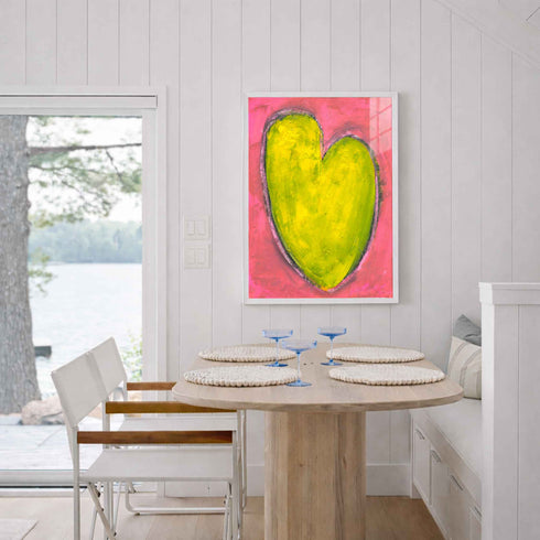 Love Note 4 art print: a tall yellow-green heart with a light outline on a bright pink background, hung in a room setting