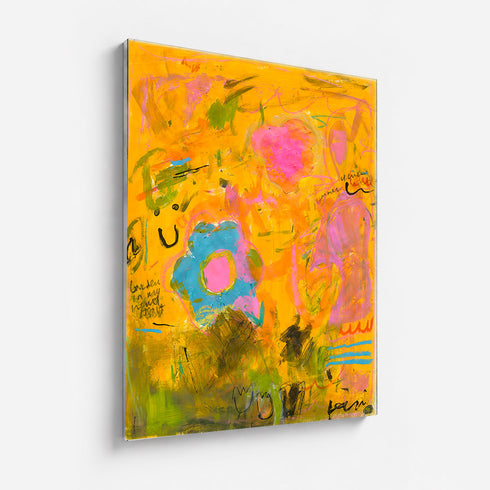 Wild Love Garden art print: a golden-orange field layered with a blue flower with a pink center, a pink blossom, olive-green patches and loose black handwritten marks, mounted under plexi with a frameless finish