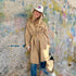 The belted, double-breasted beige trench coat is made from 100% cotton with “Sunny side up” artwork - Cute women's trench coats by Kerri Rosenthal