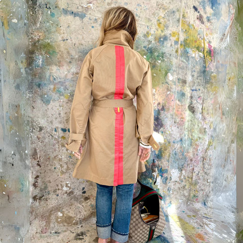 The belted, double-breasted beige trench coat is made from 100% cotton with “Sunny side up” artwork - Cute women's trench coats by Kerri Rosenthal
