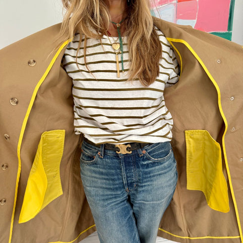 The belted, double-breasted beige trench coat is made from 100% cotton with “Sunny side up” artwork - Cute women's trench coats by Kerri Rosenthal