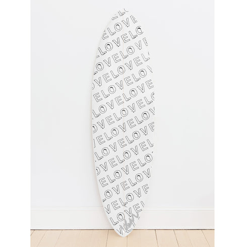 Featuring elegant hand-drawn details, this black surfboard can be hung on your wall using watertight plugs for vertical or horizontal display.