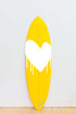 Bright yellow and white Drippy Heart surfboards by Kerri Rosenthal handmade and wall mountable