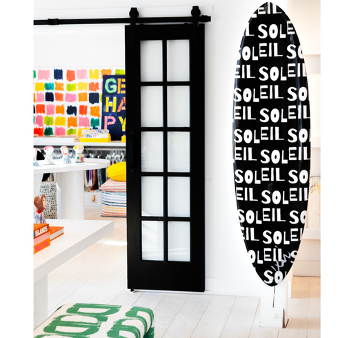 A versatile art surfboard that can be surfed, leaned against a wall, or mounted vertically or horizontally using its watertight plugs.