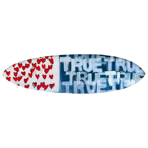 A surfboard with a geometric pattern featuring red, white, and blue colors. The board has a blue section with white text and a white section with red heart patterns.