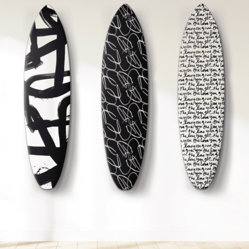 This decorative surfboard by Kerri Rosenthal makes a thoughtful gift or gallery-worthy addition to any coastal interior.