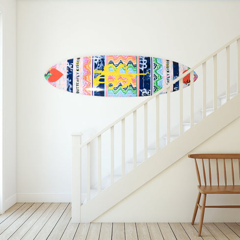 This collectible surfboard brings motion, color, and joy into your home or office as an artful, coastal accent.