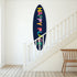 Happy Place surfboard with dark navy base and colorful letters, handmade and signed by Kerri Rosenthal.