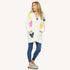 SoulCycle x KR Poppy Soul Brigade off white cardigan in 100% cotton with colorful heart patches by Kerri Rosenthal