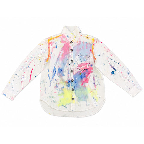 White button-down shirt hand-painted with pink, blue, and yellow watercolor-style splatters throughout and a scalloped-outline pocket at the chest — Kerri Rosenthal wearable art