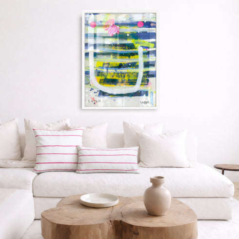 Laugh Lines colorful abstract wall art print artwork with pink stripe cute throw pillows on couch by Kerri Rosenthal