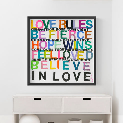 Set up your room with vibrant colors using the 'Love Rules' art print word wall framed artwork by Kerri Rosenthal - Perfect for modern living room wall decor