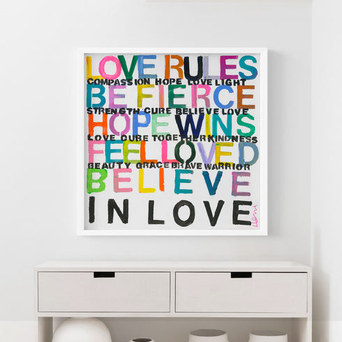 Set up your room with vibrant colors using the 'Love Rules' art print word wall framed artwork by Kerri Rosenthal