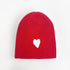 Love cherri red beanie in a cotton-cashmere blend with a white heart patch - Shop cute women’s beanies hats by Kerri Rosenthal