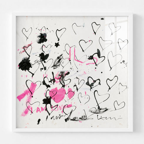 Abstract black and pink heart painting in white wood frame, expressive line-drawn hearts with "I Am Love" text on white canvas
