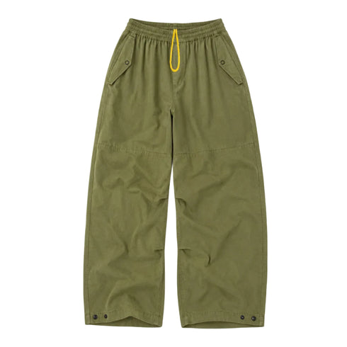 Close-up flat lay army green yellow drawstring pants. Shop women's pants at Kerri Rosenthal