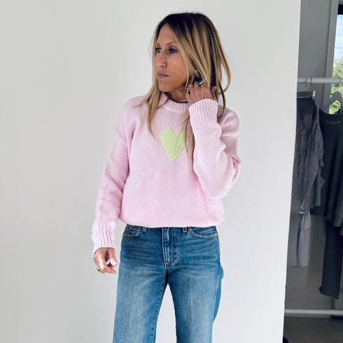 The Lovey light pink pullover sweater is made from 100% cotton with a contrast heart patch and relaxed fit - Shop cute women’s sweaters by Kerri Rosenthal