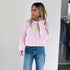 The Lovey light pink pullover sweater is made from 100% cotton with a contrast heart patch and relaxed fit - Shop cute women’s sweaters by Kerri Rosenthal