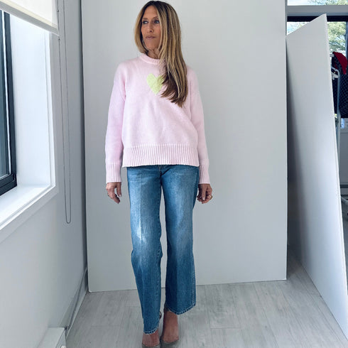 The Lovey light pink pullover sweater is made from 100% cotton with a contrast heart patch and relaxed fit - Shop cute women’s sweaters by Kerri Rosenthal