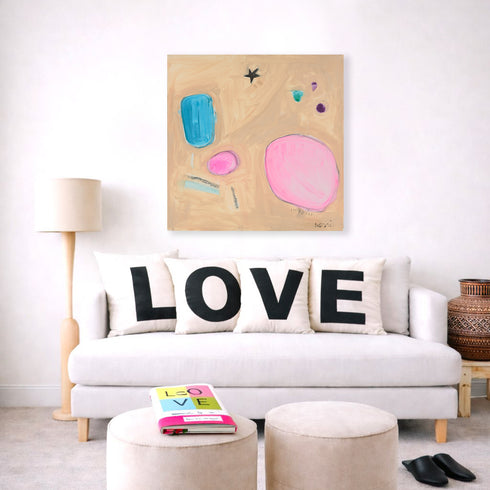 Lucky Star multicolor abstract wall art print with Love square throw pillows on couch for the living room by Kerri Rosenthal