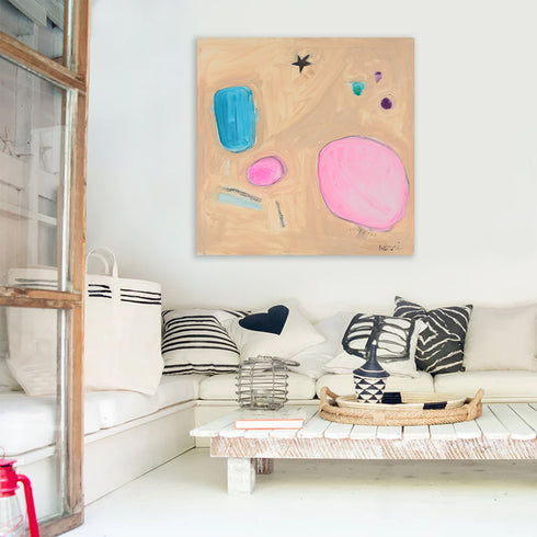 Lucky Star multicolor abstract wall art print with black and white square throw pillows on couch by Kerri Rosenthal