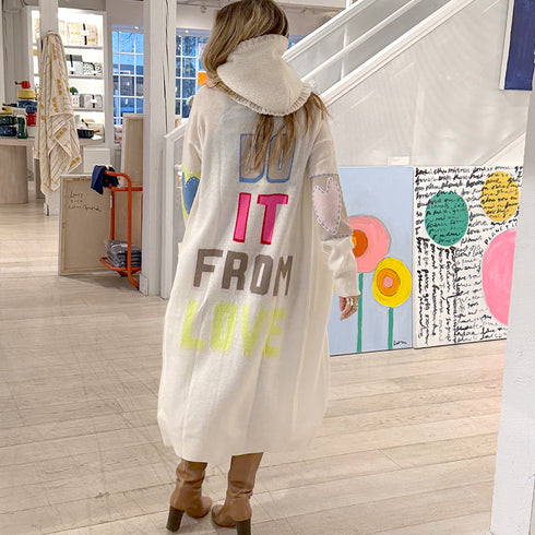 The Mc Luvin canvas hoodie is made from a wool-cashmere blend with a knit ruffled bottom and embroidered "LOVED" - Cute women’s hoodies by Kerri Rosenthal