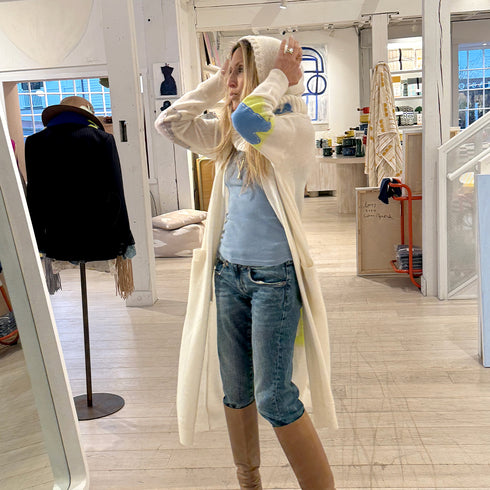 The Mc Luvin canvas hoodie is made from a wool-cashmere blend with a knit ruffled bottom and embroidered "LOVED" - Cute women’s hoodies by Kerri Rosenthal