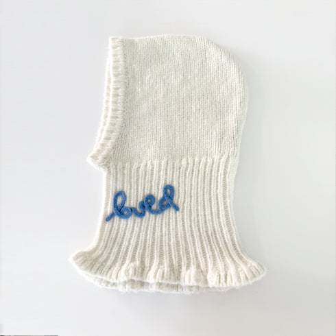 The Mc Luvin canvas hoodie is made from a wool-cashmere blend with a knit ruffled bottom and embroidered "LOVED" - Cute women’s hoodies by Kerri Rosenthal