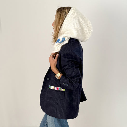 The Mc Luvin canvas hoodie is made from a wool-cashmere blend with a knit ruffled bottom and embroidered "LOVED" - Cute women’s hoodies by Kerri Rosenthal