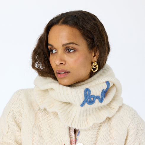 The Mc Luvin canvas hoodie is made from a wool-cashmere blend with a knit ruffled bottom and embroidered "LOVED" - Cute women’s hoodies by Kerri Rosenthal