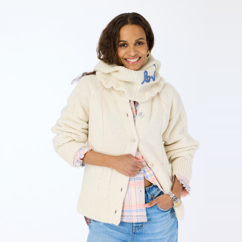 The Mc Luvin canvas hoodie is made from a wool-cashmere blend with a knit ruffled bottom and embroidered "LOVED" - Cute women’s hoodies by Kerri Rosenthal