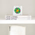Mr. Smiley Wreath Block of Love by Kerri Rosenthal, colorful mini art encased in a 4 x 4 inch plexiglass block, styled view