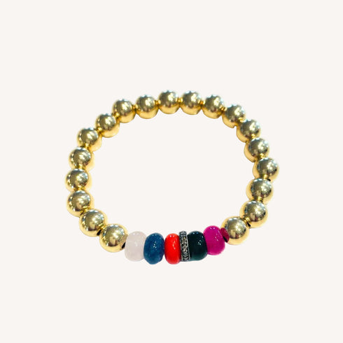 Our Gold Bead Bracelet brings a bright, beachy energy to your jewelry wardrobe with its mix of polished gold and multicolored natural stone rondels