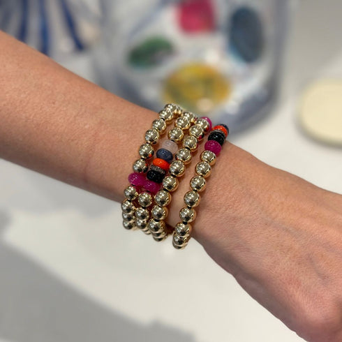 Our Gold Bead Bracelet brings a bright, beachy energy to your jewelry wardrobe with its mix of polished gold and multicolored natural stone rondels.