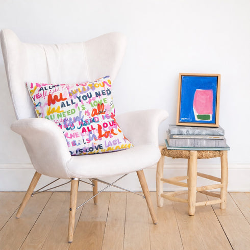 Multicolor abstract wall art print artwork and decorative throw pillow on chair by Kerri Rosenthal