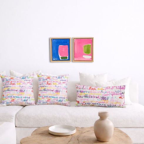 Multicolor abstract wall art print artwork and cute decorative throw pillows on couch by Kerri Rosenthal
